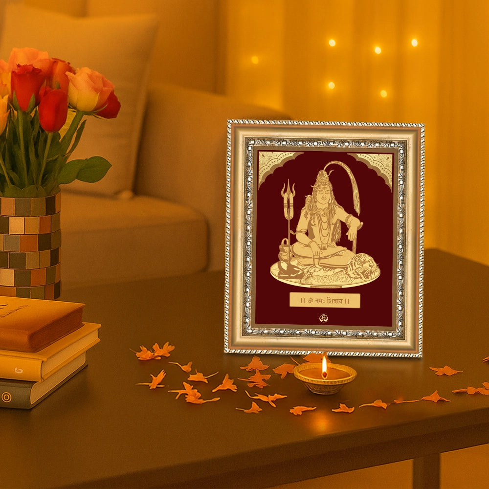 Lord Shiva divine love wall hanging in gold frame, adorned with flowers and incense, showcasing spiritual elegance.