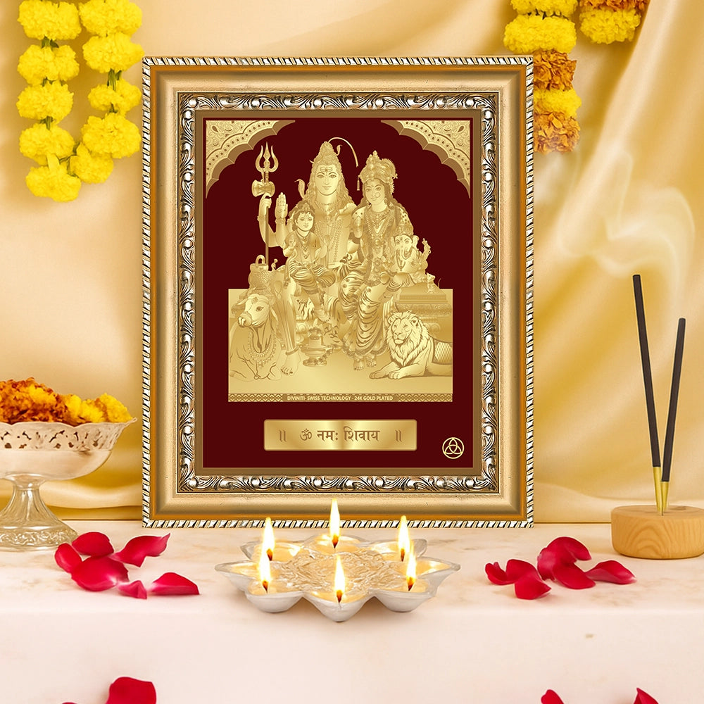 Shiva Parivar wall hanging in a decorative gold frame, featuring Lord Shiva, Goddess Parvati, Ganesha, and Kartikeya, set on an altar.