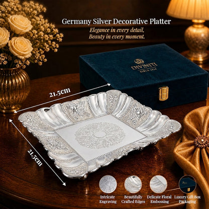 Diviniti German Silver Decorative Platter with Luxury Gift Box on a table, showcasing elegance and detail.