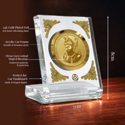 Guru Gobind Singh Ji 24K gold plated car dashboard frame with crystal-clear acrylic design for elegance and spirituality.