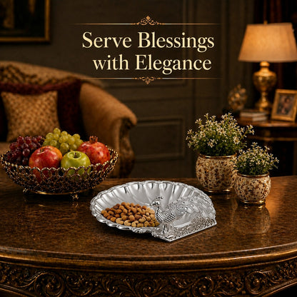 Diviniti Silver Peacock German Silver Dry Fruit Bowl with Gift Box elegantly displayed with fruits and decor on a table.