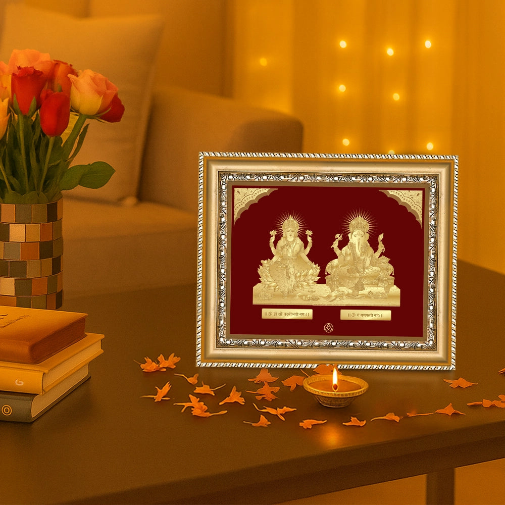 Lakshmi Ganesh Tabletop Frame 24k Gold Foil displayed on wooden table