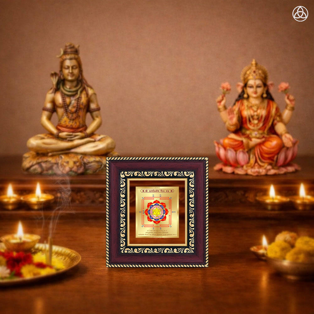 Swarn Akarshan Yantra displayed on a decorated altar with candles and idols of Hindu deities for spiritual harmony.