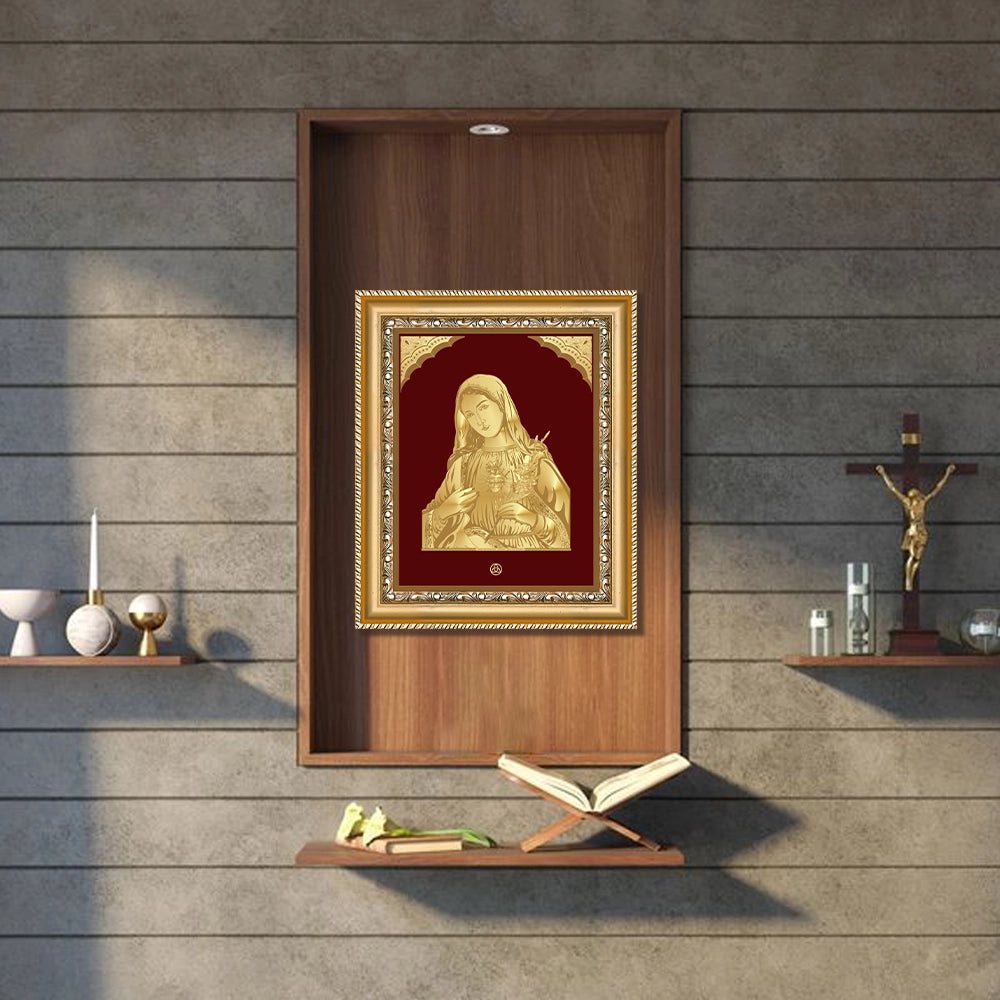 Mother Mary Photo frame in a gold wall hanging, elegantly displayed in a wooden shelf with spiritual decor.