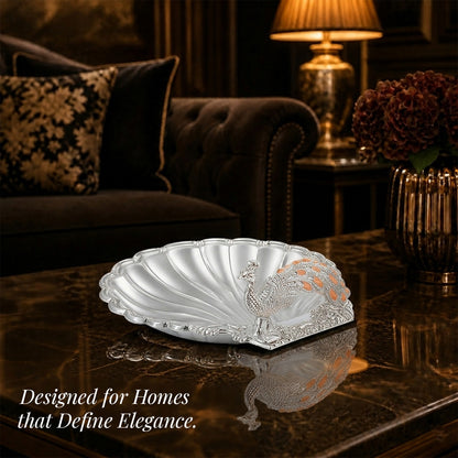 Diviniti Amber Peacock German Silver Dry Fruit Bowl elegantly displayed in a sophisticated living room setting.
