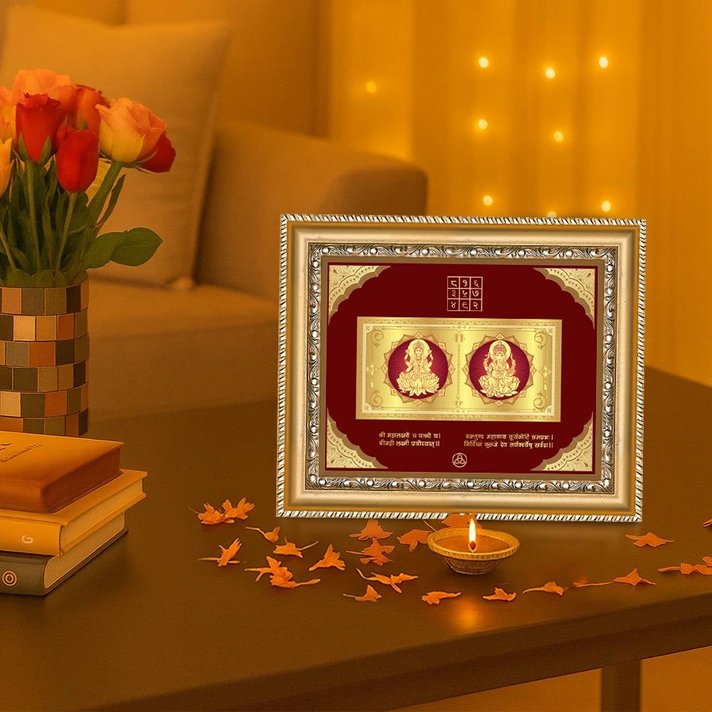 Lakshmi Ganesh with Mantra frame in 24k gold plated foil displayed on beautiful wooden table