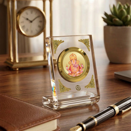 Dagadu Ganesha 24K gold plated car dashboard frame elegantly displayed on a wooden desk