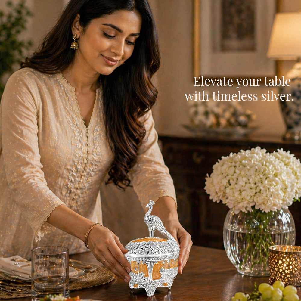 Diviniti German Silver Peacock Sugar Bowl with Spoon & Luxury Gift Box being showcased on a beautifully set dining table.