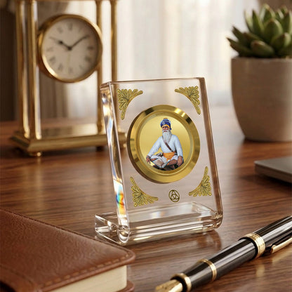 Baba Deep Singh Ji 24K gold plated car dashboard frame elegantly displayed on a wooden desk.
