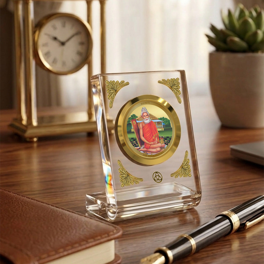 Baba Lokenath 24K gold plated car dashboard frame elegantly displayed on a wooden desk.