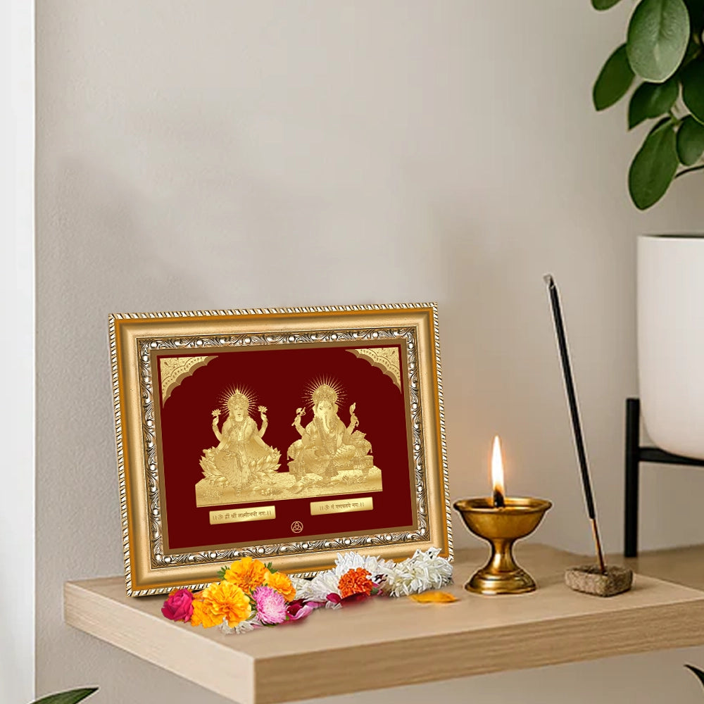 Lakshmi Ganesh Tabletop Frame 24k Gold Foil displayed on wooden shelf
