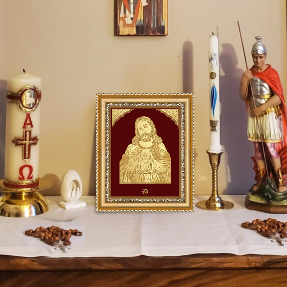 Jesus Christ photo frame in 24k gold plated foil displayed on beautiful decorated wooden table