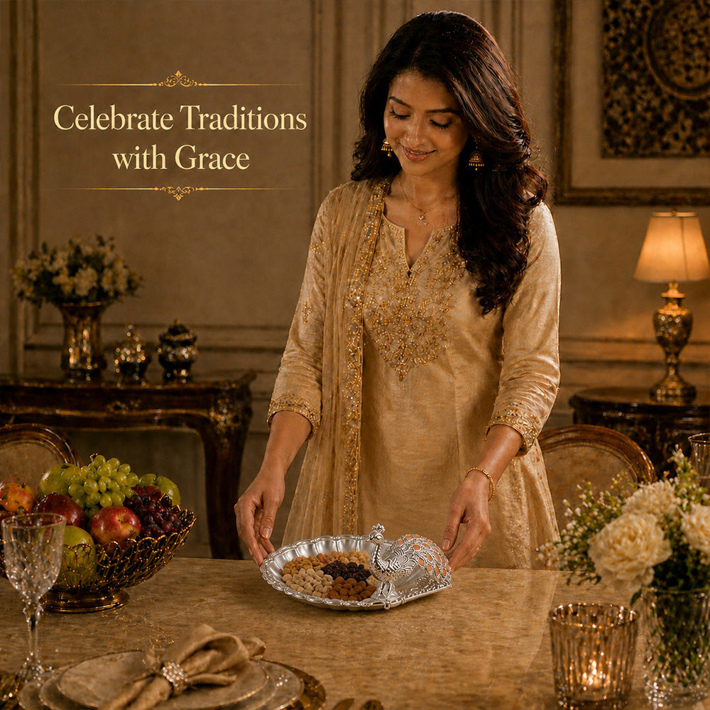 Woman celebrating traditions with a Diviniti Amber Peacock German Silver Dry Fruit Bowl at a festive table.