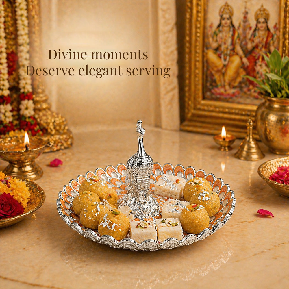 Diviniti Amber Peacock German Silver Platter elegantly serving sweets and snacks on a festive table setting.