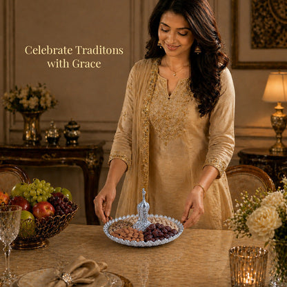 Diviniti Silver Peacock German Silver Platter elegantly displayed on a dining table with fruits, showcasing traditional celebration.