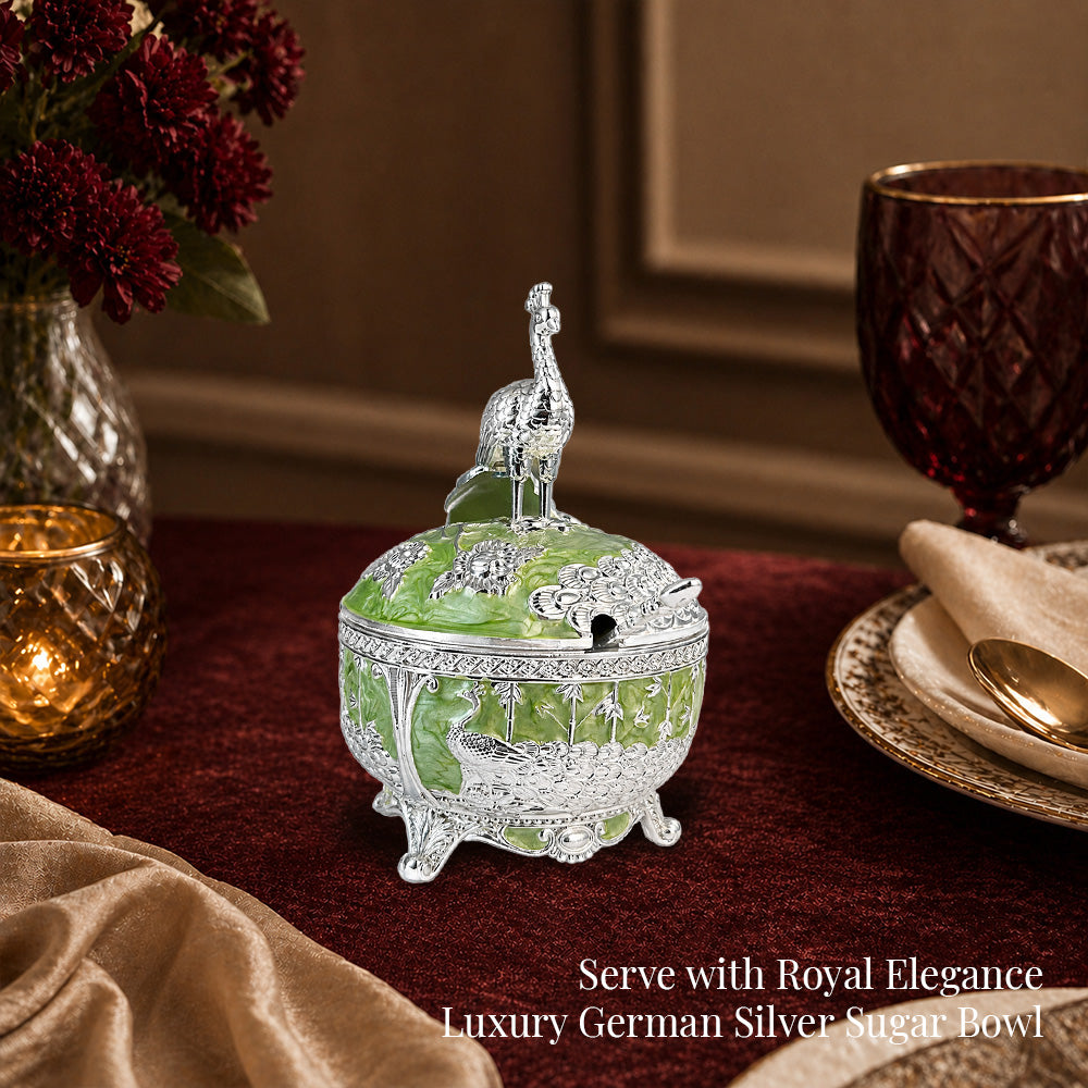 Diviniti German Silver Peacock Sugar Bowl with Spoon in luxury setting with green finish and decorative spoon.