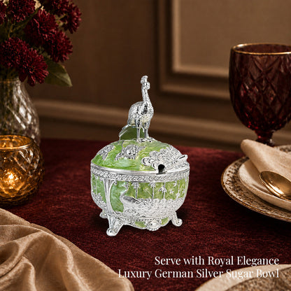 Diviniti German Silver Peacock Sugar Bowl with Spoon in luxury setting with green finish and decorative spoon.