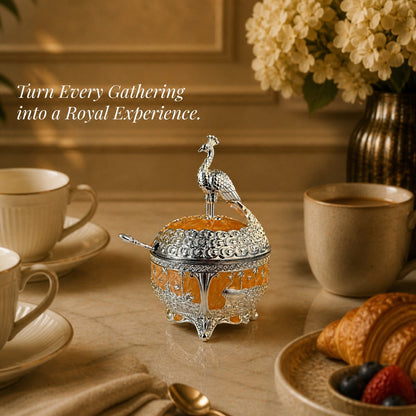 Diviniti German Silver Peacock Sugar Bowl with Spoon & Luxury Gift Box displayed elegantly on a dining table.