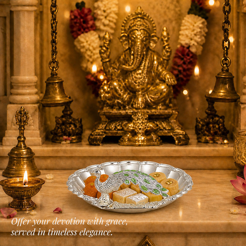 Diviniti Green Peacock German Silver Dry Fruit Bowl with Gift Box, elegantly displayed with sweets and Ganesha statue.
