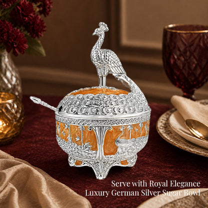 Diviniti German Silver Peacock Sugar Bowl with Spoon & Luxury Gift Box elegantly displayed on a dining table.