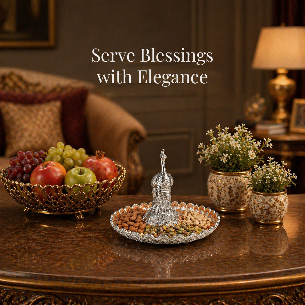 Diviniti Amber Peacock German Silver Platter displayed elegantly with fruits and decorative plants.