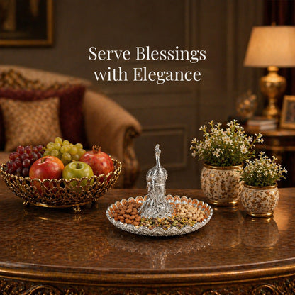 Diviniti Amber Peacock German Silver Platter displayed elegantly with fruits and decorative plants.