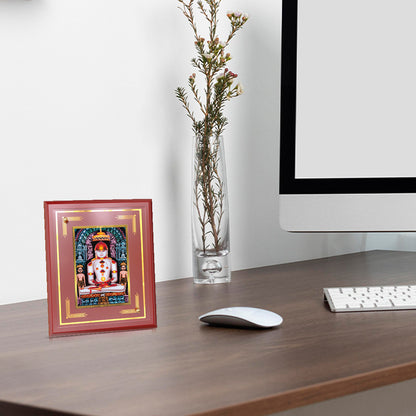 Bhagwan Adinath Tabletop Photo Frame displayed on wooden table