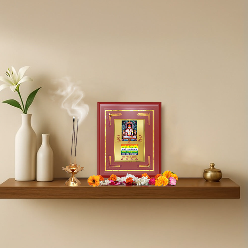 Lord Adinath with Namokar Mantra displayed on wooden shelf