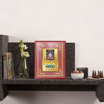Lord Adinath with Namokar Mantra displayed on wooden shelf