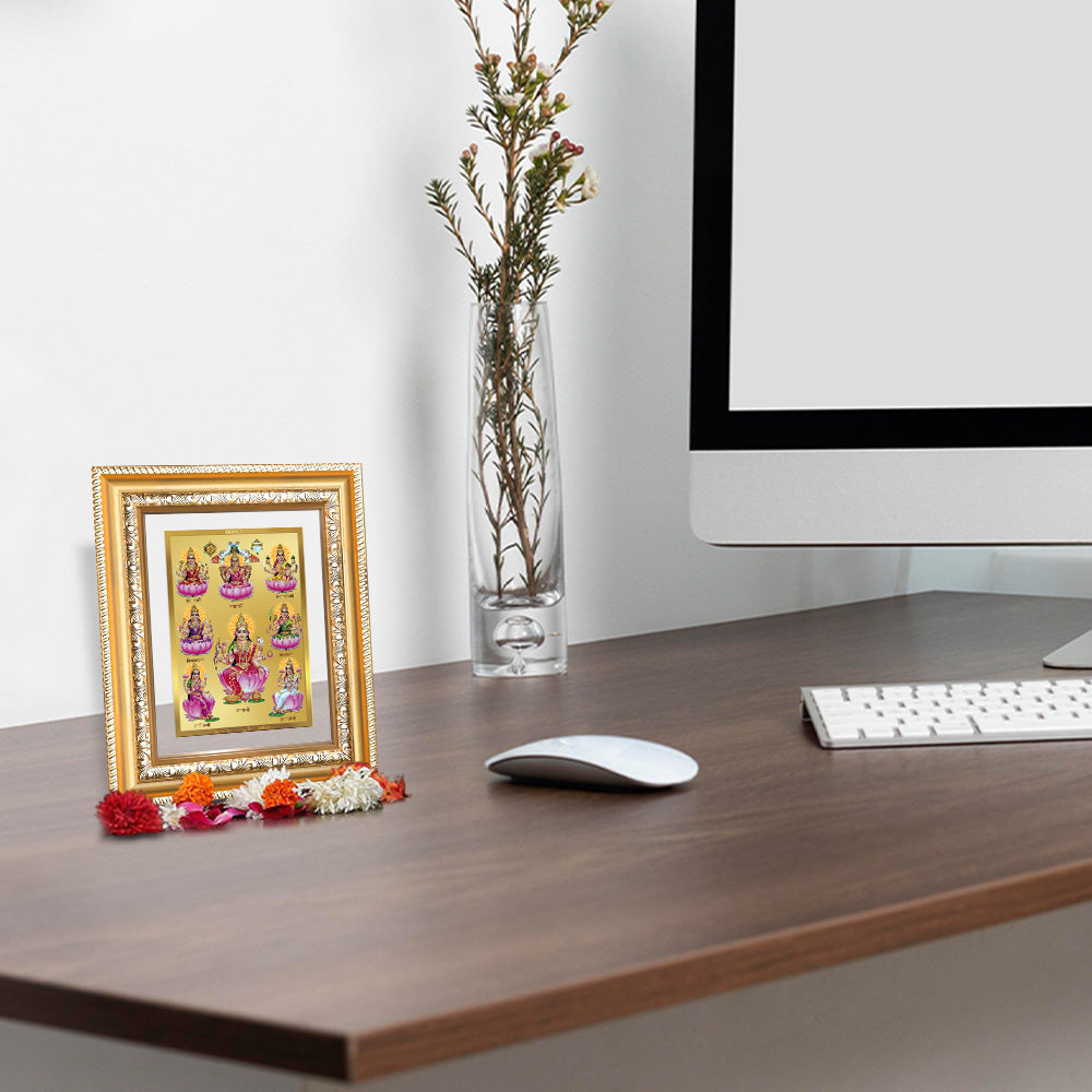 Ashtalakshmi photo frame in 24K gold plated foil displayed in a beautifully decorated wooden wall shrine