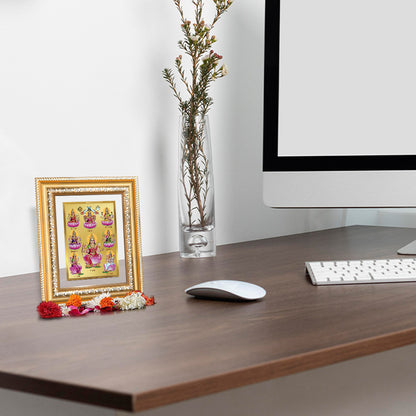 Ashtalakshmi photo frame in 24K gold plated foil displayed in a beautifully decorated wooden wall shrine