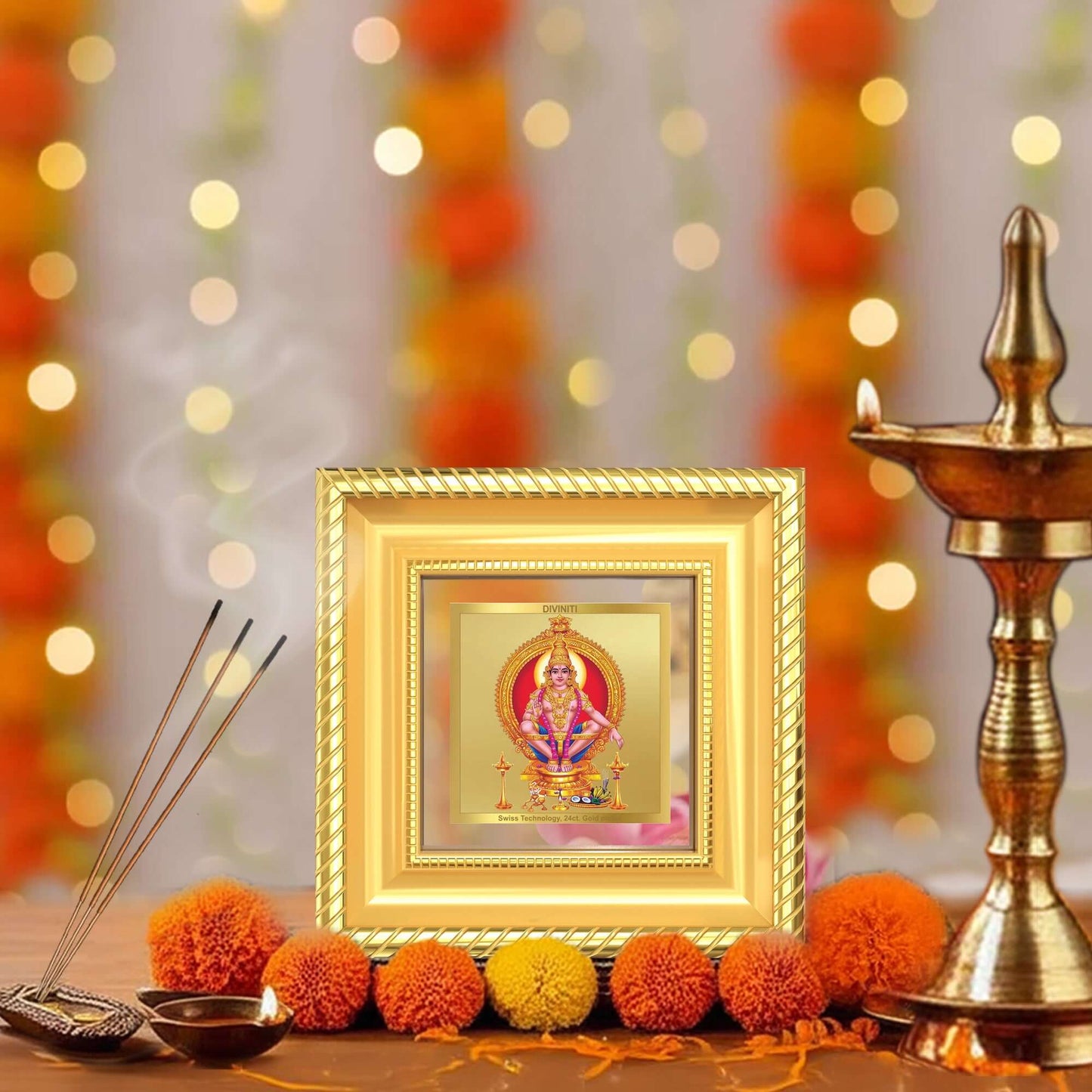 Lord Ayyappan Hariharan Frame in a beautifully designed wall and tabletop photo frame, adorned with vibrant marigold flowers.