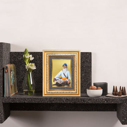 Baba Deep Singh Ji Tabletop Photo Frame in 24K Gold Plated Foil displayed on wooden table