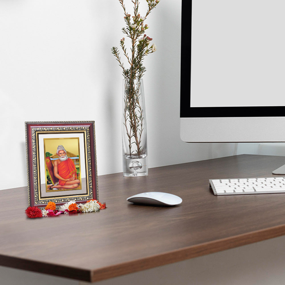 Baba Lokenath 24K Gold Plated Foil Tabletop Photo Frame displayed on wooden table