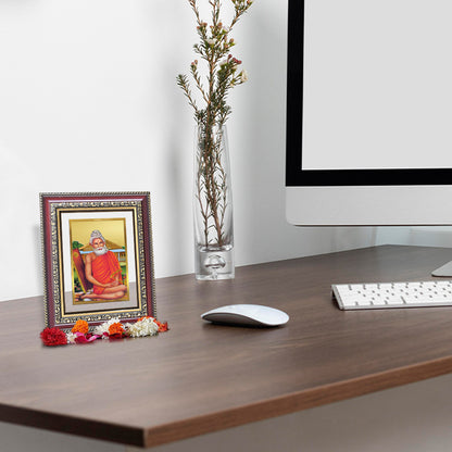 Baba Lokenath 24K Gold Plated Foil Tabletop Photo Frame displayed on wooden table