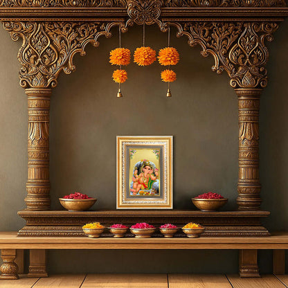  Baby Ganapati Wall Frame in 24K Gold Plated Foil displayed in home temple