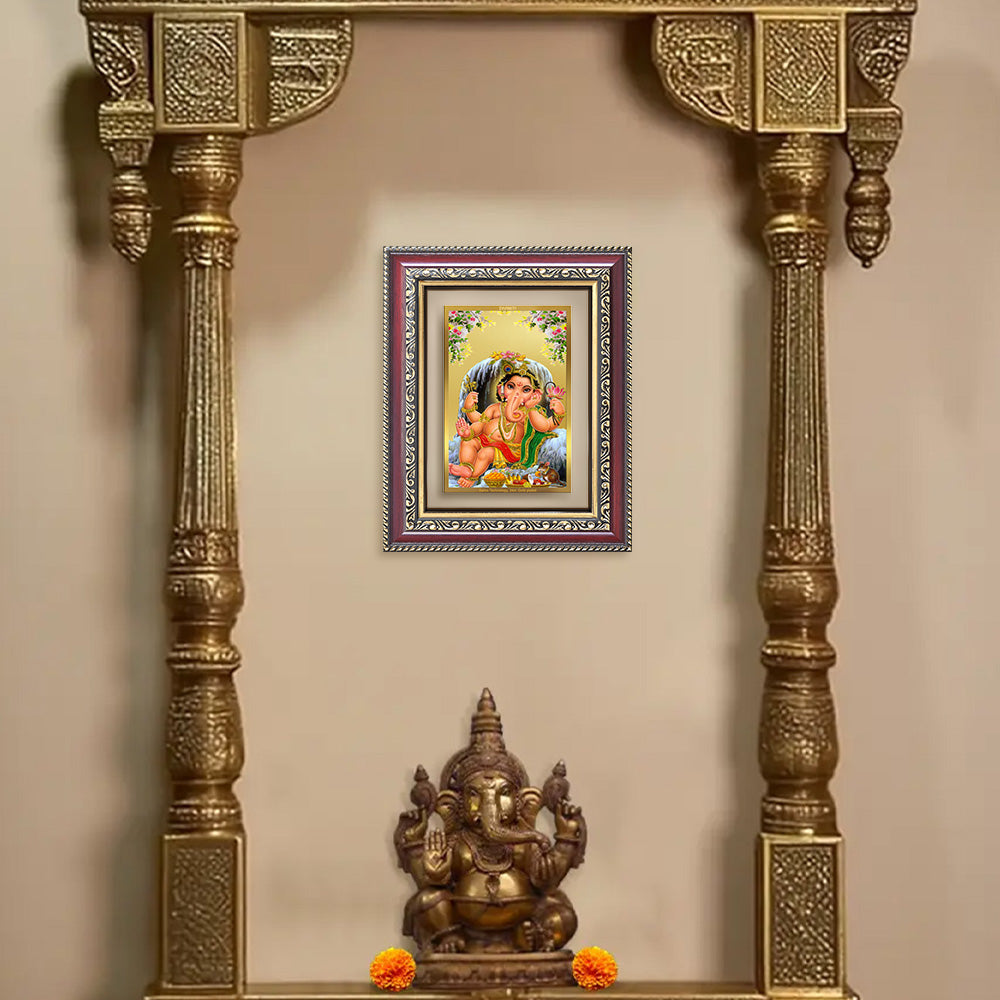 Bal Ganesha Photo Frame in 24K Gold Plated Foil displayed on wall of puja room