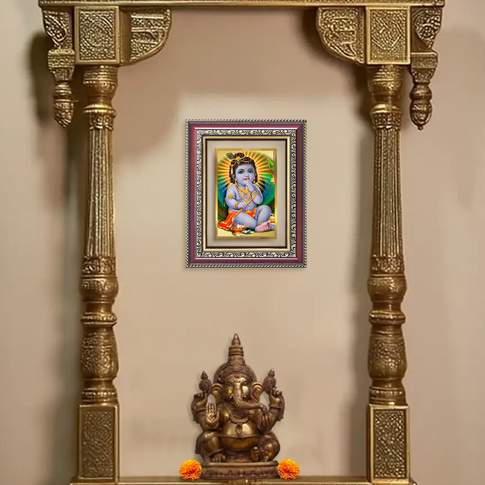 Bal Gopal photo frame in 24k gold plated foil displayed on wall of puja room