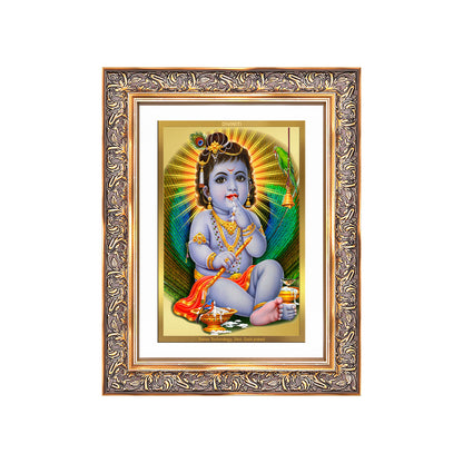 Baby Krishna gold photo frame featuring young Lord Krishna playfully enjoying butter in a stunning 24K gold plated frame.