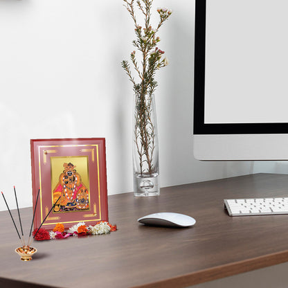 Kunjbihari Tabletop Photo Frame in 24K gold foil on a desk with flowers and incense holder.