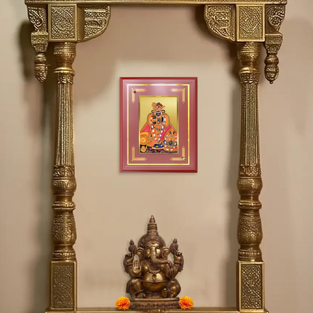 Kunjbihari Tabletop Photo Frame displayed on a decorative wooden altar with a Lord Ganesha statue below.