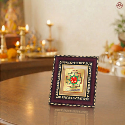 Durga Yantra framed in 24K gold-plated foil on a wooden table with traditional decor.