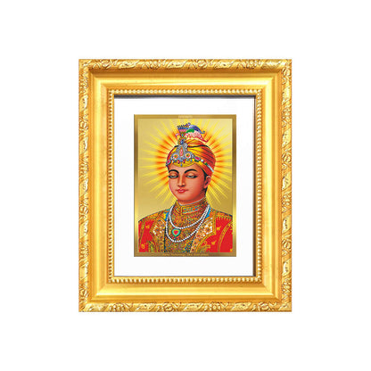 Guru Harkrishan Sahib Ji framed artwork in 24K gold plated foil symbolizing compassion and healing.