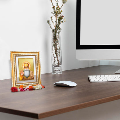 Guru Nanak Dev Ji Photo Frame in 24K Gold Plated Foil displayed on wooden table