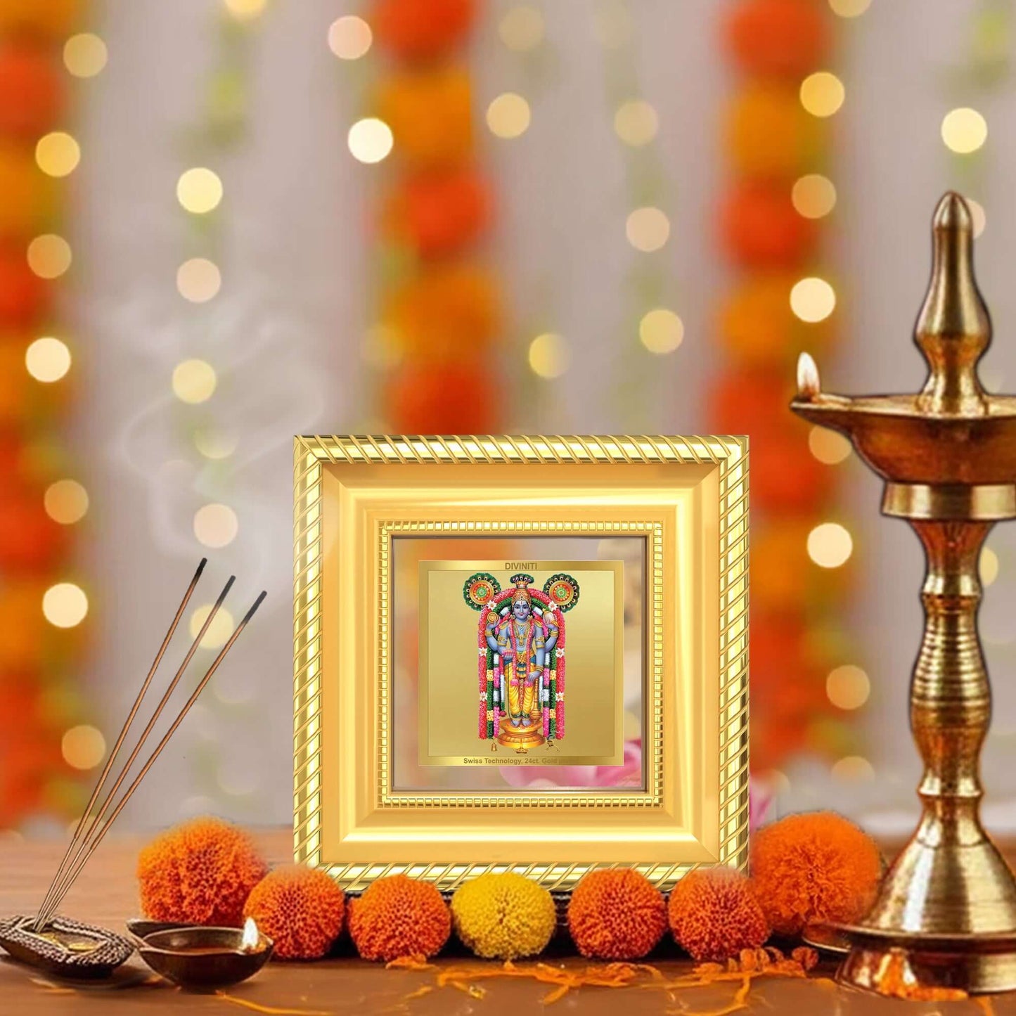 Guruvayurappan Tabletop Frame in a beautifully designed wall and tabletop photo frame, adorned with vibrant marigold flowers.