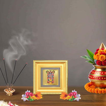Guruvayurappan Tabletop Frame displayed in a beautifully decorated wooden wall shrine.