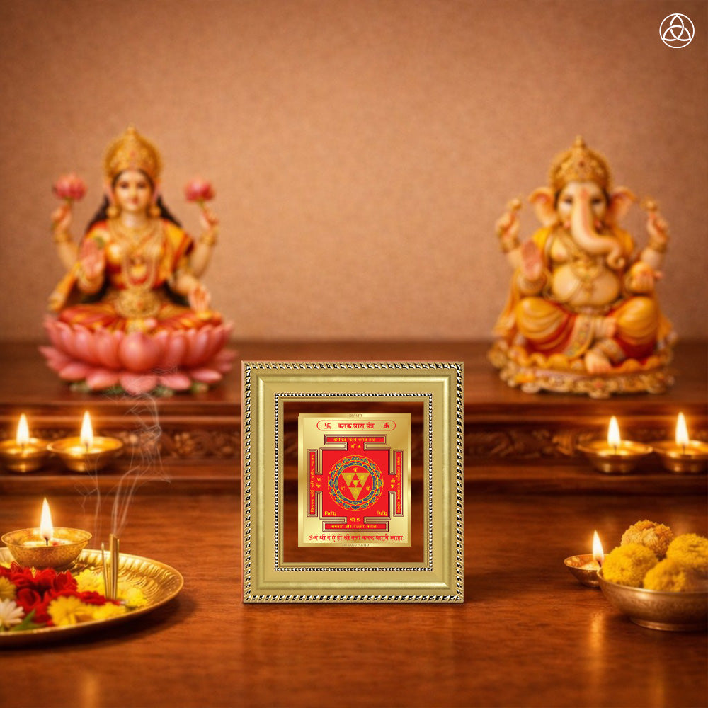Kanak Dhara Yantra framed artwork with Goddess Lakshmi and Ganesha statues in a spiritual setting.
