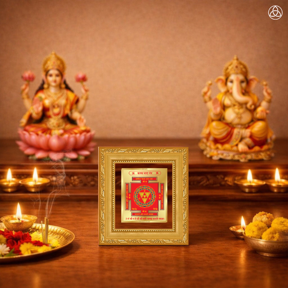 Kanak Dhara Yantra framed artwork with Goddess Lakshmi and Ganesha statues in a spiritual setting.