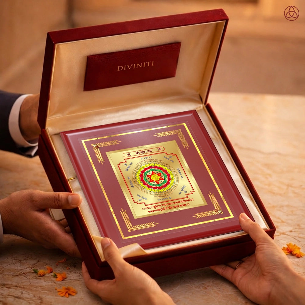Kuber Yantra in a luxurious frame held in hands, symbolizing wealth and prosperity, beautifully crafted in 24K gold-plated foil.