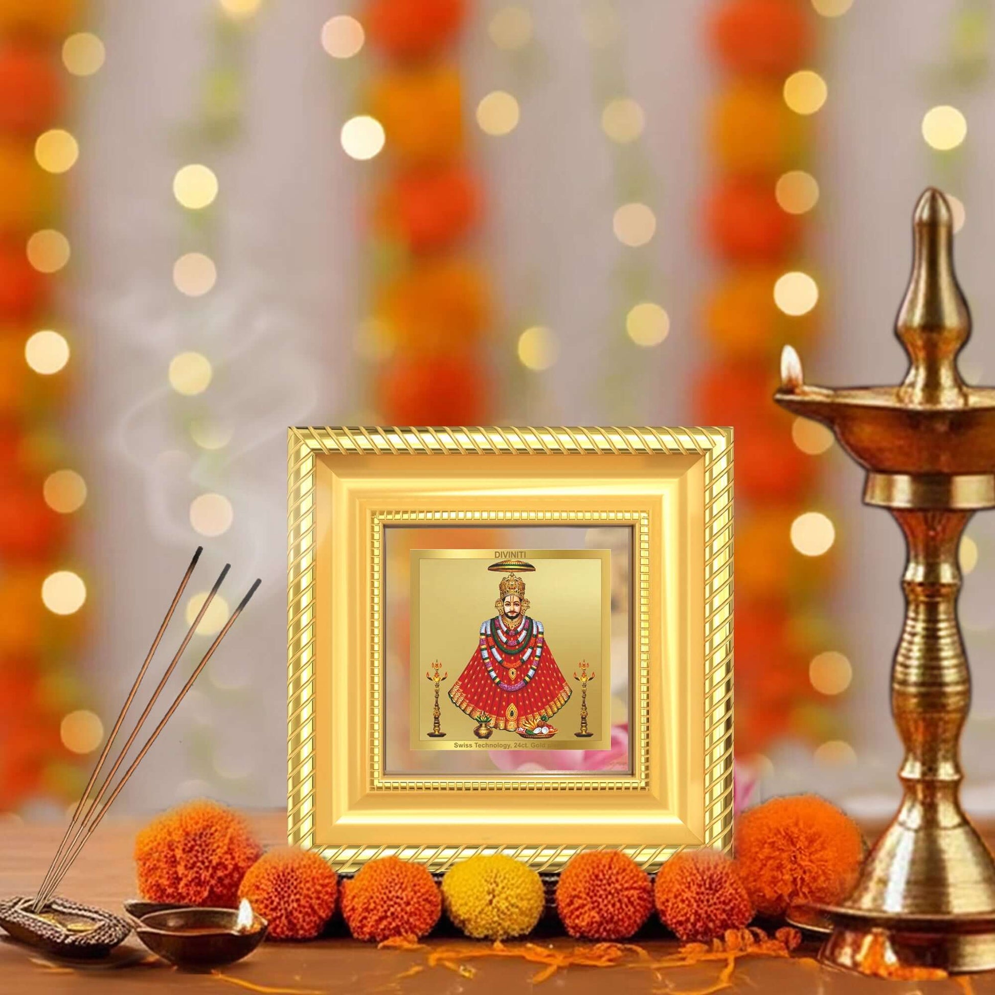 Khatu Shyam Ji Tabletop Frame in 24k gold plated foil in a beautifully designed wall and tabletop photo frame, adorned with vibrant marigold flowers.